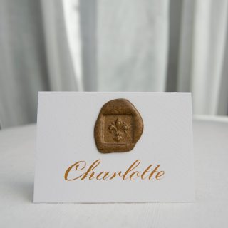 Simple, classic and elegant - perfect for weddings or events where less is more.  This tented A7 (when folded) place card with a wax seal and classic gold ink calligraphy on a slightly textured Tintoretto Gesso card is one of my favourite place cards. ⁠
⁠
You can choose different styles of wax seal stamp designs such as an olive branch, a bee or as seen here a classic Fleur de Lys.  You can also choose the colour of your ink and wax seal to match your theme.⁠
⁠
I've just added it to the website so ordering is just a click away or you can send me a message if you would like this for your event.⁠
⁠
I'm celebrating today the fact the sun is finally out, hurrah!  I might even put my shorts on!⁠
⁠
I hope you are having a lovely day too. 😊⁠
⁠
#missmoderncalligraphy #moderncalligraphy #placesettings #placecards #weddingstationery #eventstationery #lettering #weddingcalligraphy #goldleaf #handlettering #lettering #tablesetting #calligraphy #destinationwedding #weddingday #weddingdayinspo #gettingmarried #goldink #pointedpen #nib #ink #calligrapher  #handlettering  #lovecalligraphy  #calligraphystyle  #dailydoseofpaper #pursuepretty #happyweddingday #fineartcuration #waxsealstamp⁠